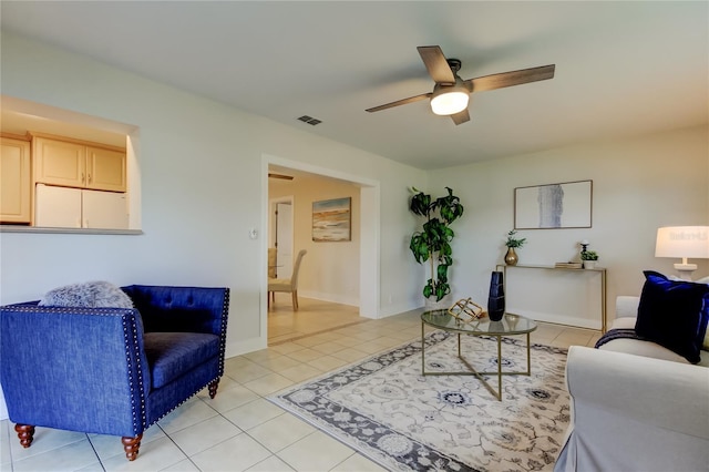 tiled living room featuring ceiling fan