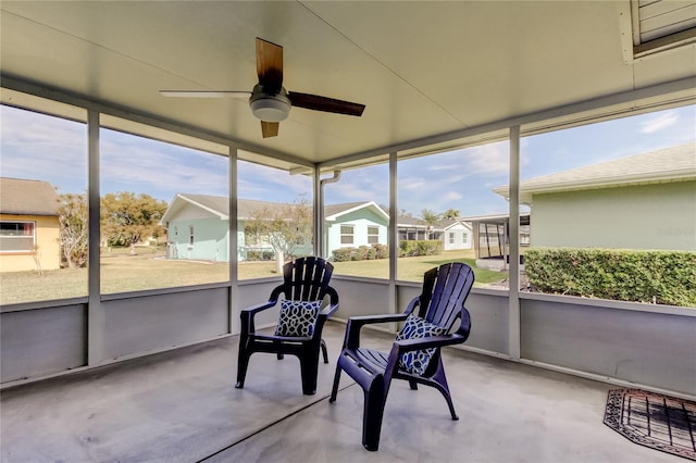 sunroom / solarium with ceiling fan