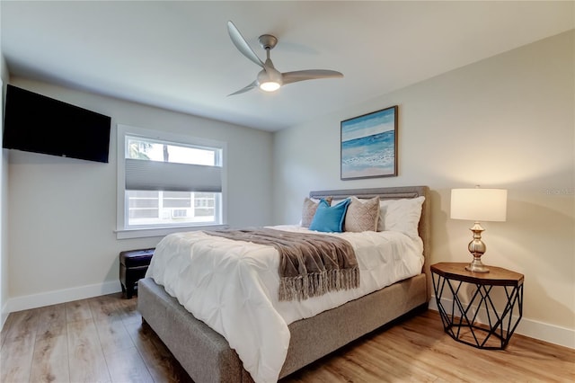 bedroom featuring hardwood / wood-style flooring and ceiling fan