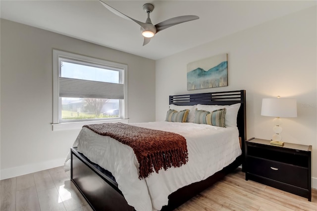 bedroom featuring ceiling fan and light hardwood / wood-style floors