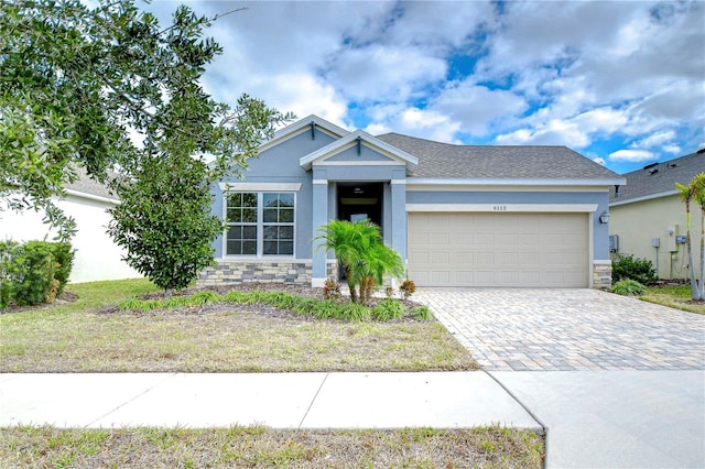 view of front of property with a garage