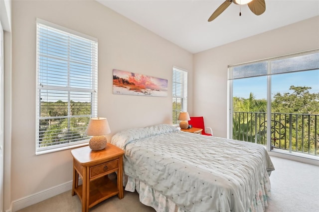 carpeted bedroom with access to outside and ceiling fan