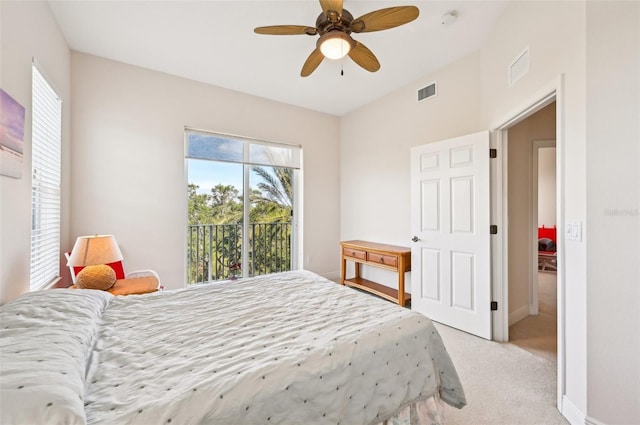 bedroom featuring ceiling fan, multiple windows, light carpet, and access to outside