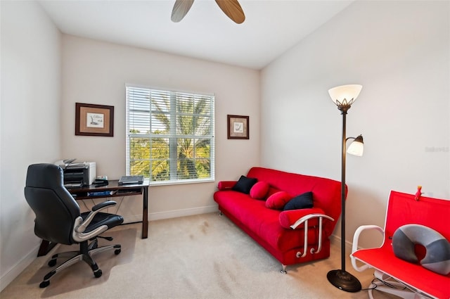 office space featuring lofted ceiling, ceiling fan, and carpet flooring