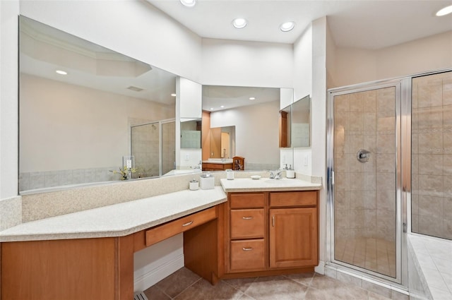 bathroom featuring vanity, tile patterned flooring, and a shower with shower door