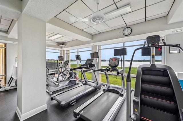 exercise room with a drop ceiling