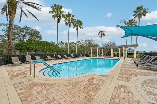 view of pool with a patio and a pergola