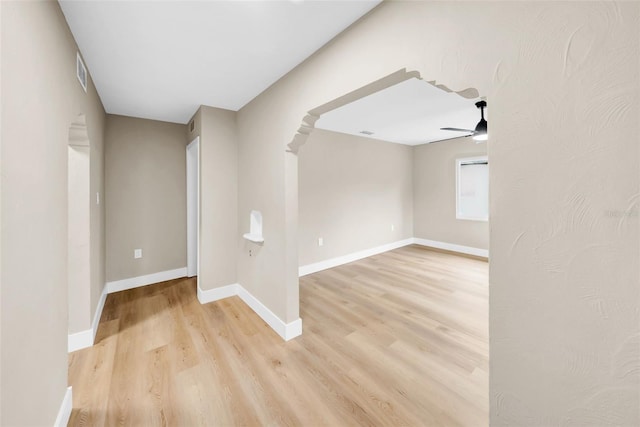 spare room with light hardwood / wood-style floors and ceiling fan