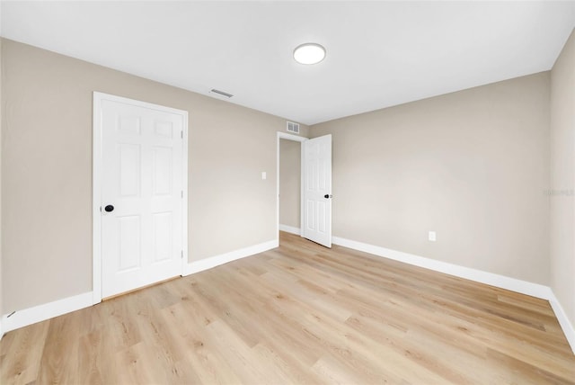 unfurnished bedroom with light wood-type flooring