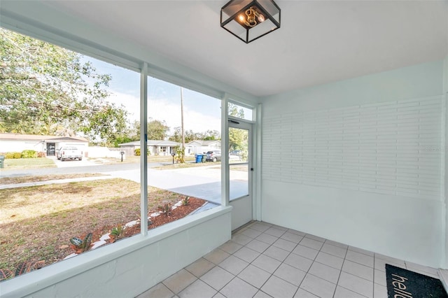 unfurnished sunroom with plenty of natural light