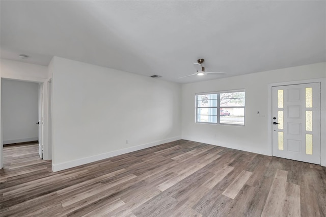 interior space with ceiling fan and light hardwood / wood-style flooring