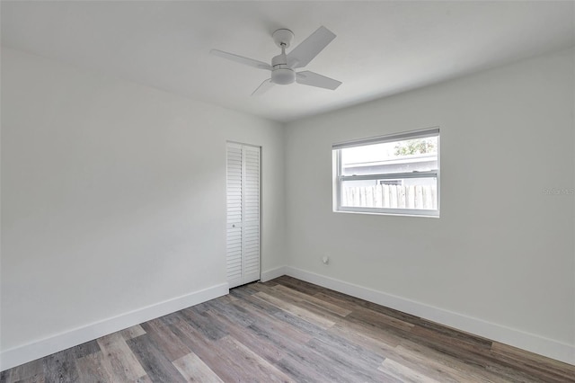 empty room featuring light hardwood / wood-style flooring and ceiling fan