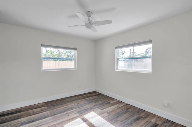 empty room with ceiling fan and hardwood / wood-style floors