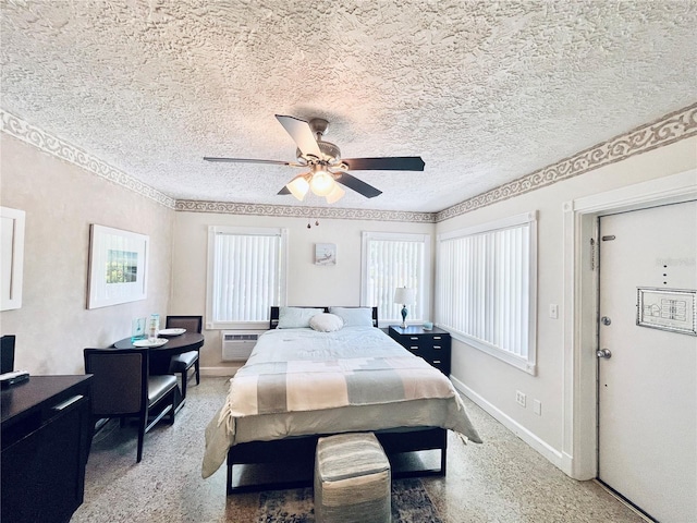 bedroom featuring multiple windows, ceiling fan, and a textured ceiling