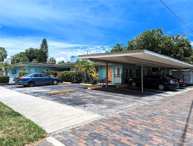 view of partially covered parking lot