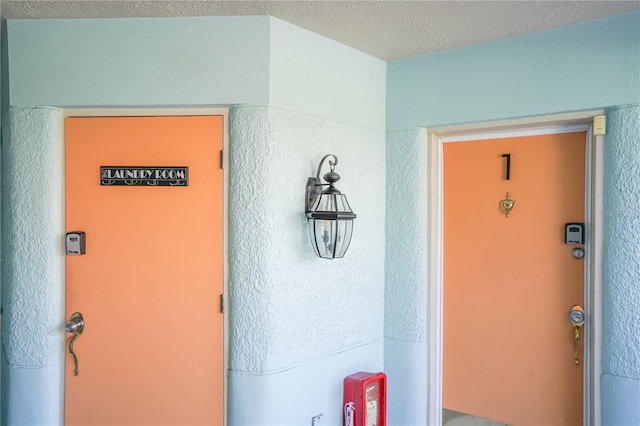 property entrance featuring stucco siding