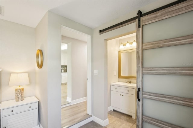 bathroom with visible vents, vanity, and baseboards