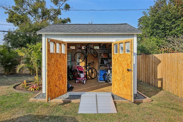 view of shed with fence