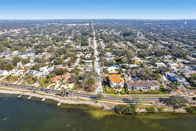 drone / aerial view featuring a water view and a residential view