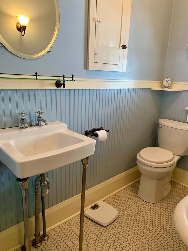 bathroom featuring tile patterned flooring and toilet