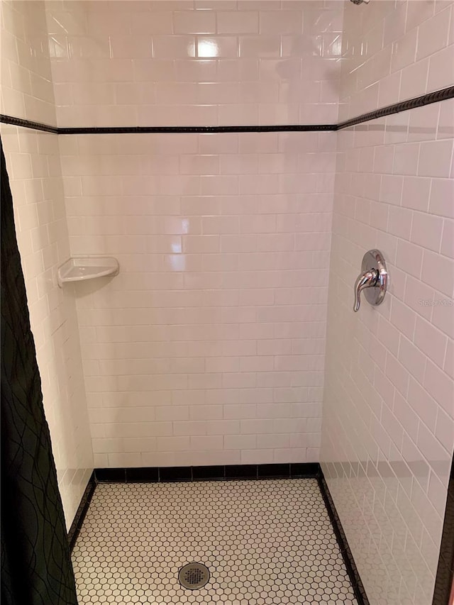 bathroom with a tile shower