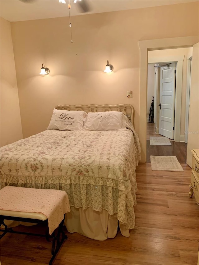 bedroom featuring ceiling fan and light wood-type flooring