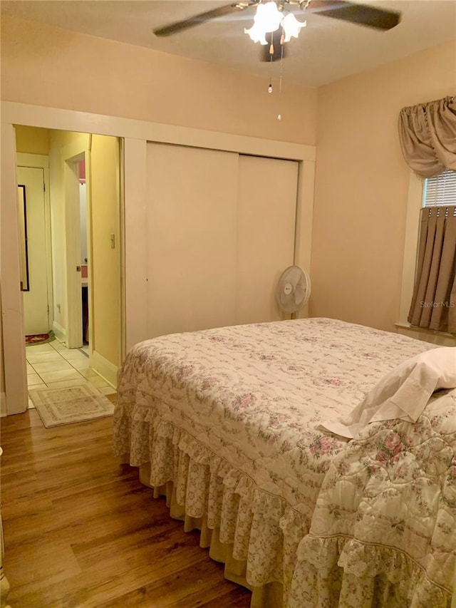 bedroom with wood-type flooring and ceiling fan