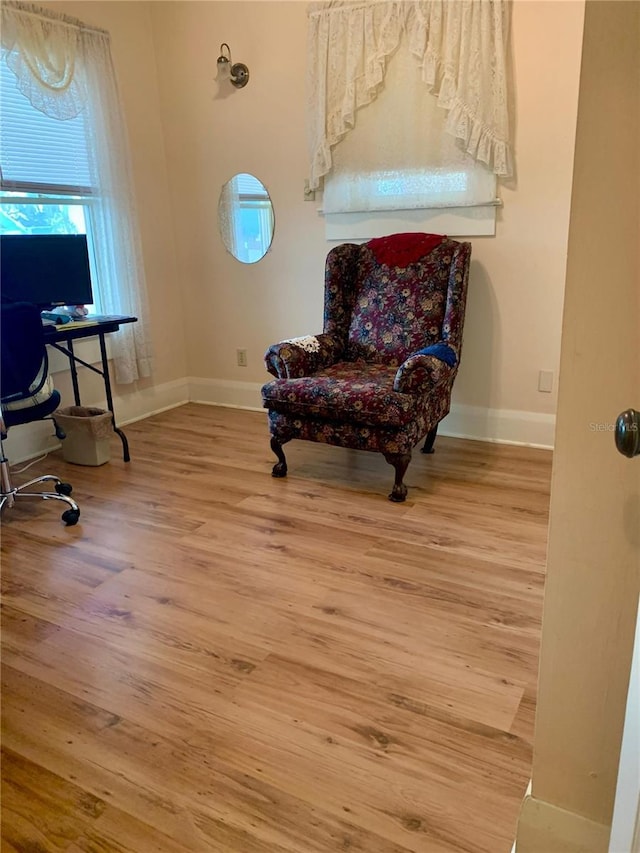 sitting room with hardwood / wood-style flooring