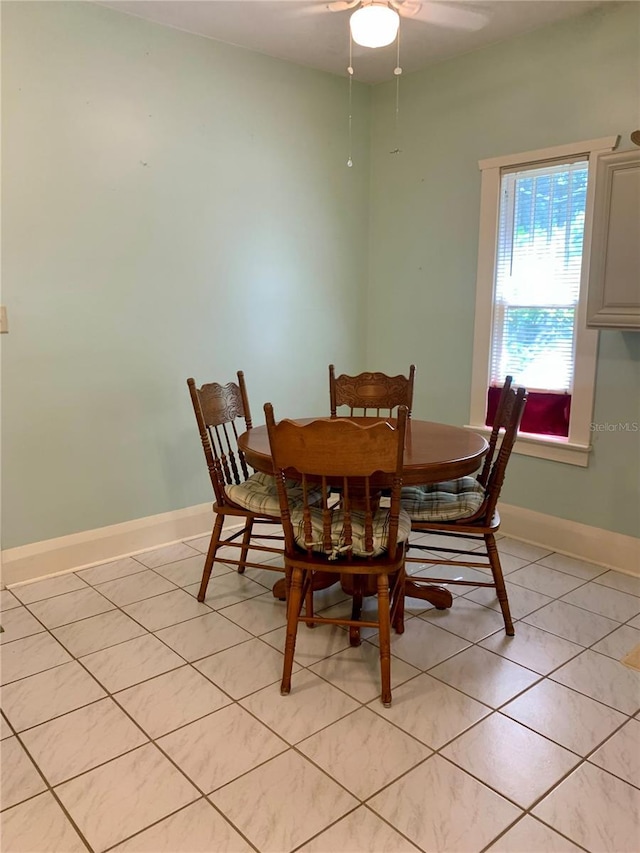 tiled dining room with ceiling fan