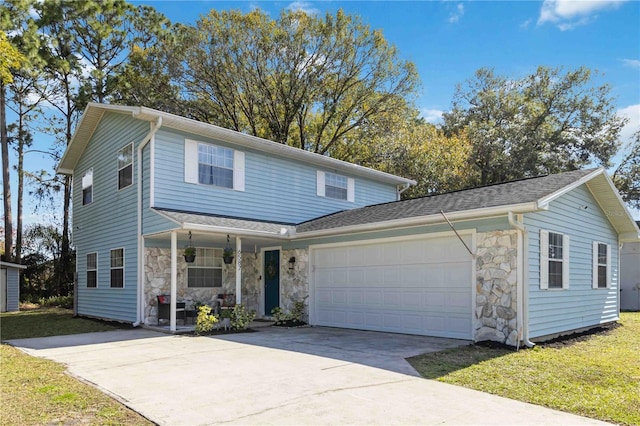 front facade featuring a garage and a front lawn