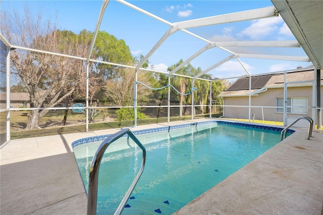 view of pool with a lanai and a patio area