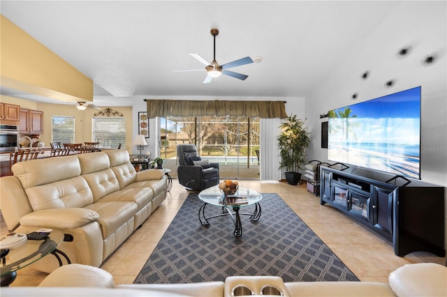 tiled living room featuring vaulted ceiling and ceiling fan