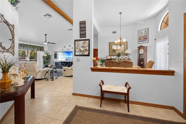 interior space with an inviting chandelier, beam ceiling, and light tile patterned flooring