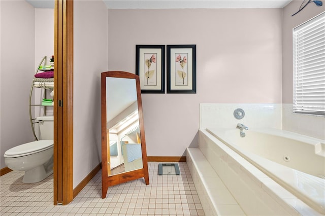 bathroom with a relaxing tiled tub, tile patterned floors, and toilet