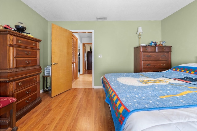 bedroom with light wood-type flooring