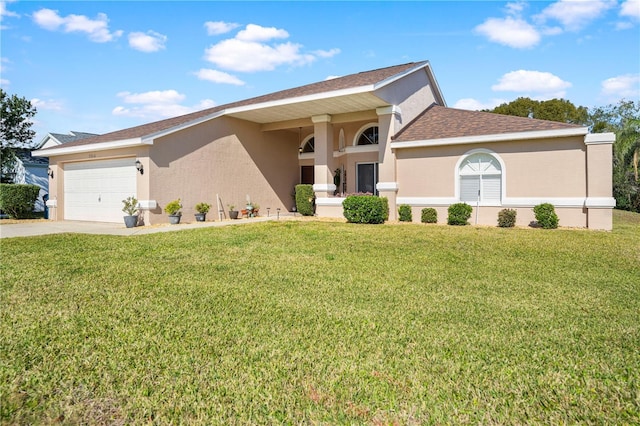 view of front of house featuring a garage and a front yard