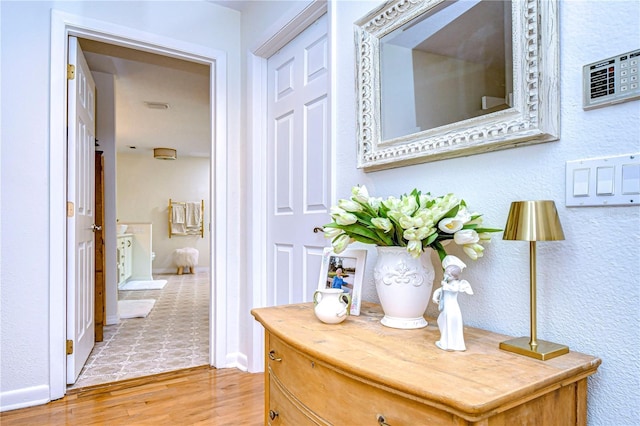 corridor featuring light hardwood / wood-style floors