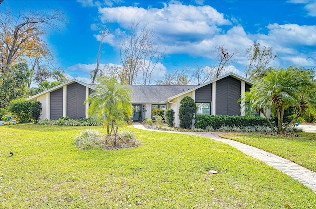 ranch-style house with a front lawn