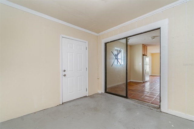 empty room featuring ornamental molding