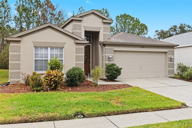 view of front of home featuring a garage and a front lawn