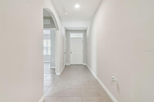 hallway featuring light tile patterned floors