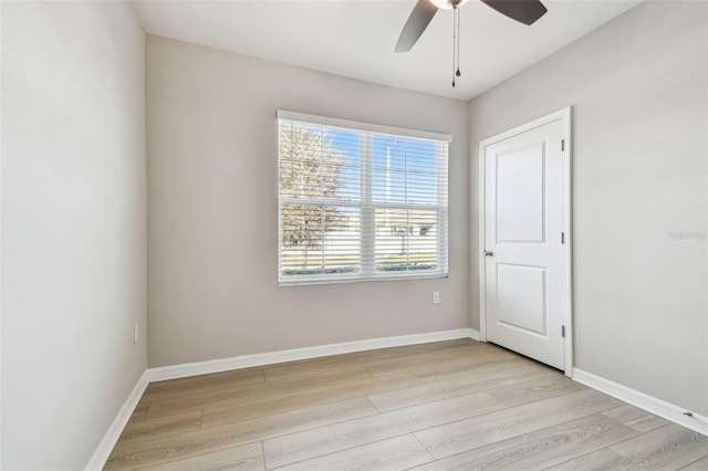 spare room featuring ceiling fan and light wood-type flooring