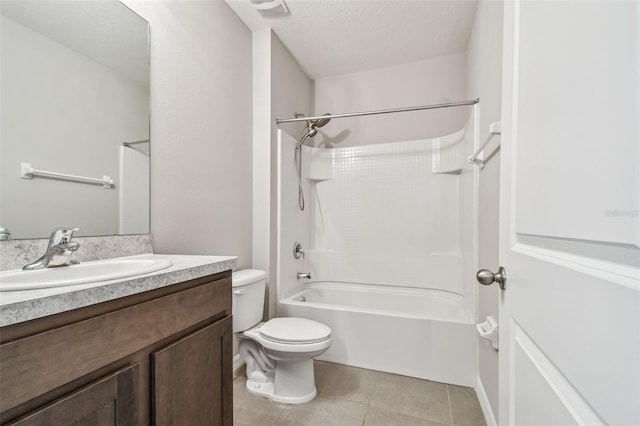 full bathroom with tile patterned flooring, vanity, toilet, bathing tub / shower combination, and a textured ceiling