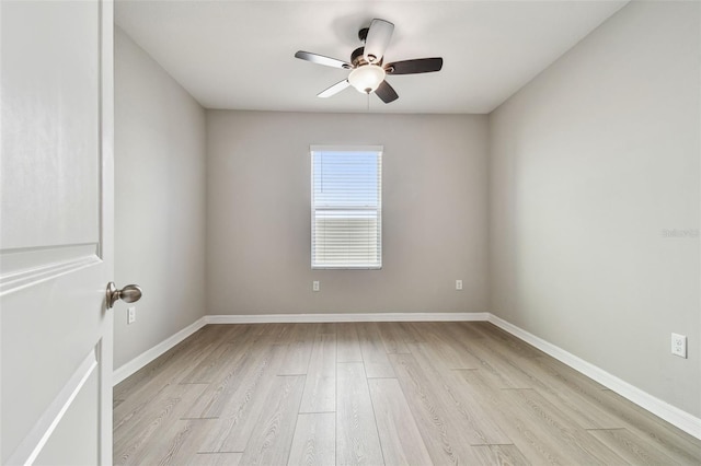 spare room featuring ceiling fan and light wood-type flooring