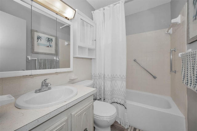 full bathroom featuring toilet, shower / tub combo, and vanity