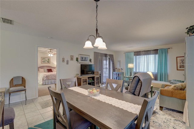 dining space featuring light tile patterned floors