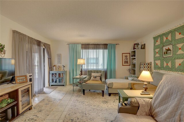 living room featuring tile patterned floors and a textured ceiling