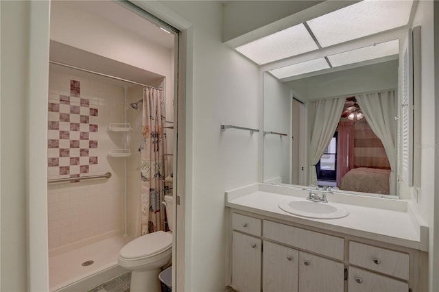 bathroom featuring vanity, toilet, and a shower with shower curtain