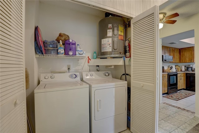 laundry room featuring separate washer and dryer, electric water heater, ceiling fan, and light tile patterned flooring