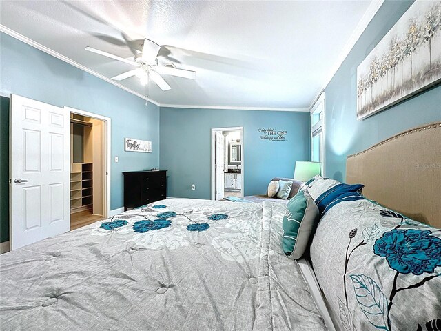 bedroom featuring crown molding, ensuite bath, and ceiling fan